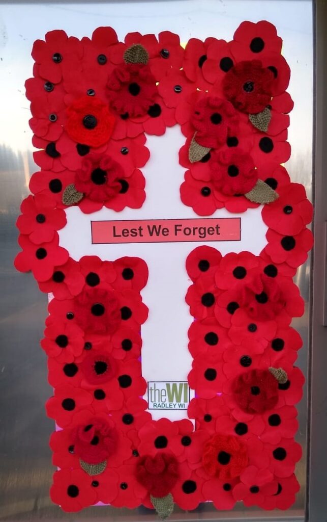 Poppy display created by members of Radley WI in the window at Radley Village Shop, November 2022for 