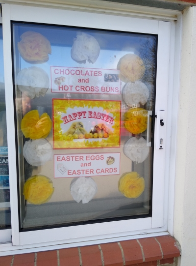 Easter poster in window of Radley Village Shop, 2023