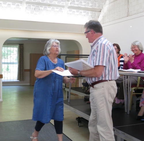 As chairman, Bob presents his wife Pat with his 15-year  Long Service Certificate at the Shop's Annual General Meeting in November 2022