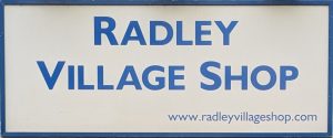 Sign on wall above entrance to Radley Village Shop